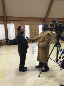 Rabbi Ariel Sadwin speaking to a reporter from WBAL