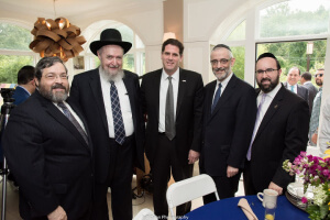 Rabbi Abba Cohen, Rabbi Sheftel Neuberger (president of Ner Israel Rabbinical College), Israeli Ambassador Ron Dermer, Rabbi Chaim Dovid Zwiebel, and Rabbi Ariel Sadwin