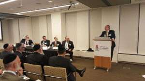 Rabbi Yitzchak Breitowitz, Jonathan Rikoon, Dr. Marcel Biberfeld, Dr. Howard Lebowitz, and Mark Kurzmann (speaking)