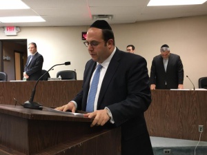 Rabbi Schnall delivering the invocation at the swearing-in ceremony of the Lakewood Township government where Agudath Israel of America's 2015 William K. Friedman Leadership awardee Menashe Miller was sworn in as mayor.