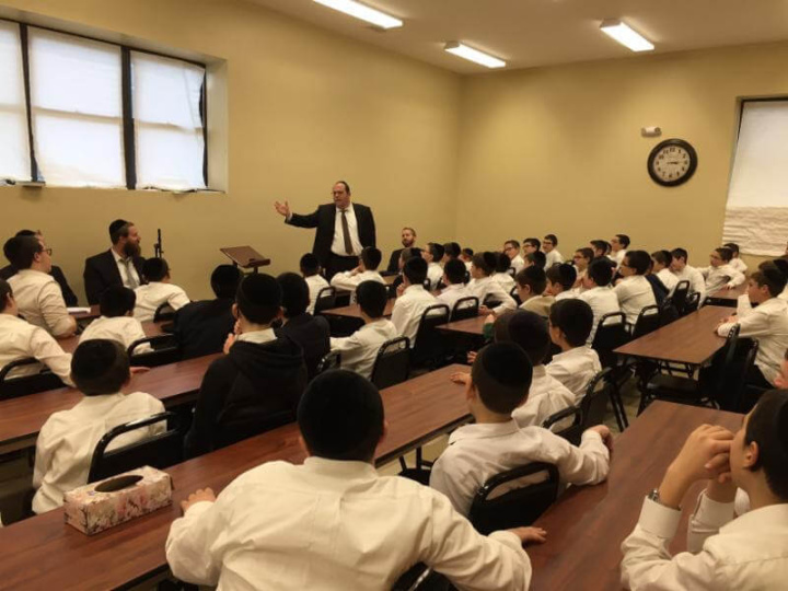 Agudath Israel's New Jersey director, Rabbi Avi Schnall, speaking to students of Yeshivas Sha'agas Aryeh about the history of Agudath Israel of America and the importance of helping the larger community. 