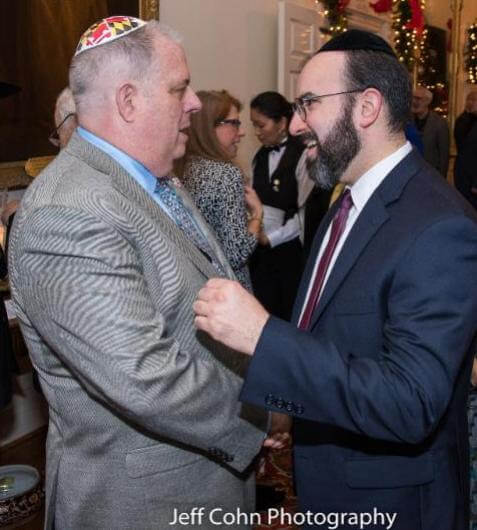 Rabbi Ariel Sadwin with Governor Hogan at the governor's Chanukah party.
