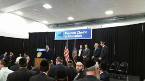 Agudath Israel's chairman of the board of trustees, Sol Werdiger, speaking at the rally in support of the "Parental Choice in Education" initiative